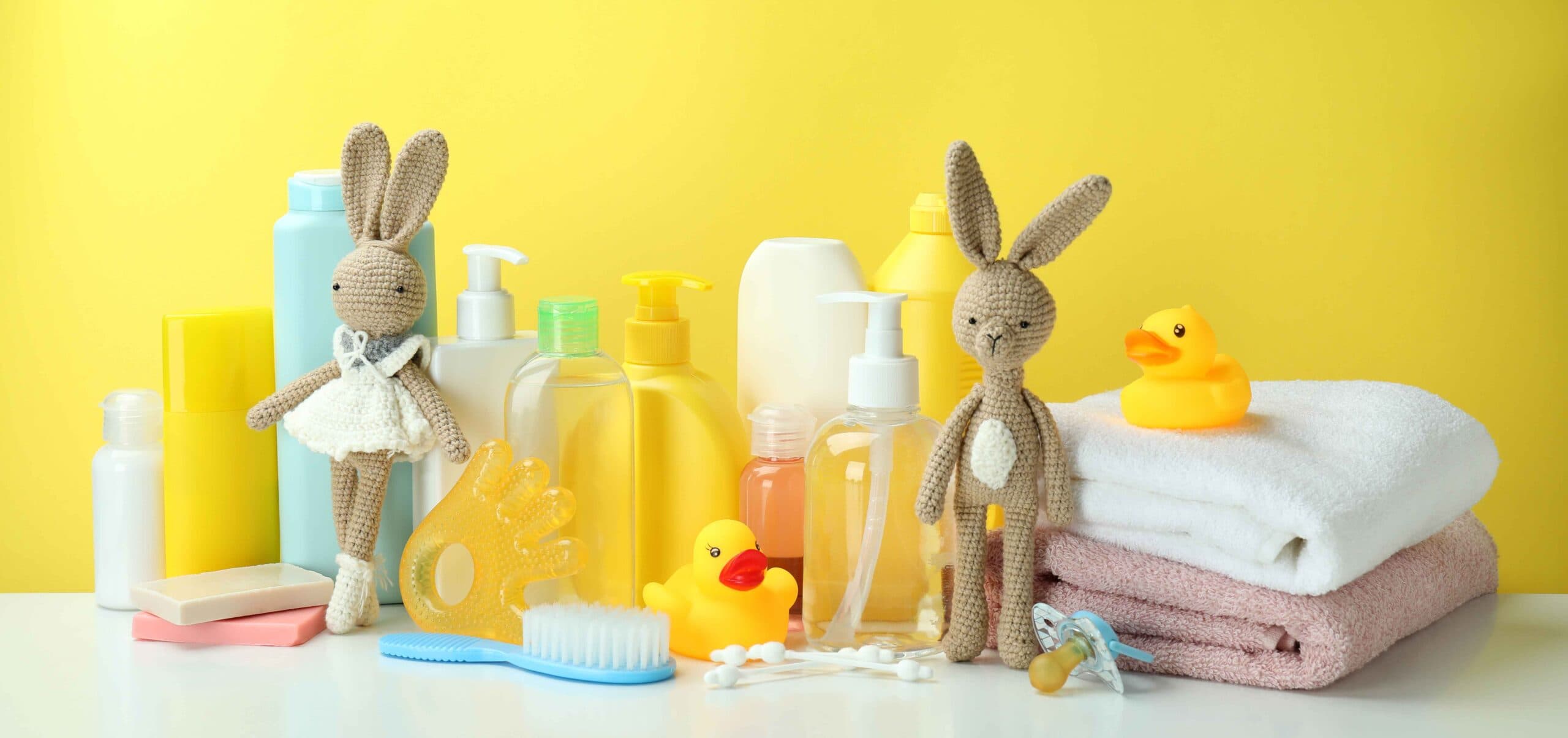 different-baby-hygiene-accessories-against-yellow-background-1-scaled